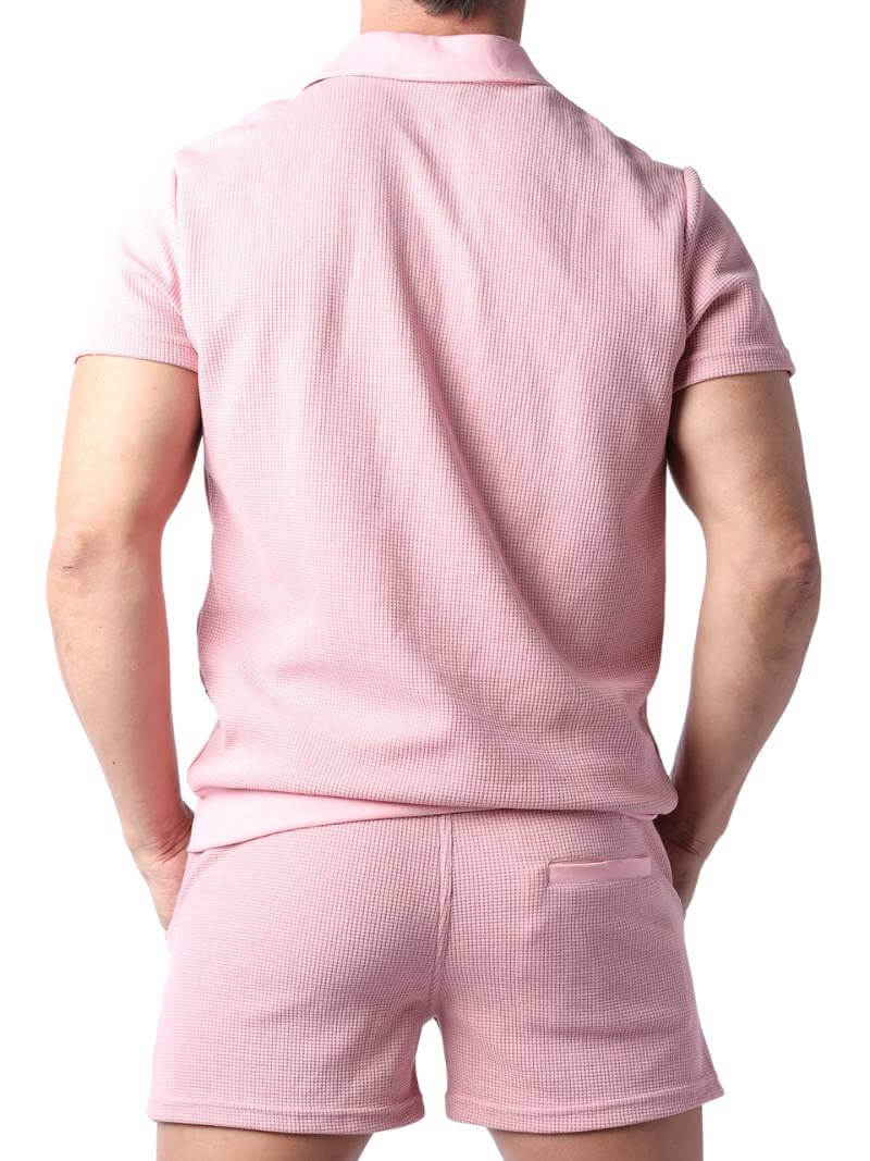 Close-up of a pink checkered garment with a focus on texture and pattern.