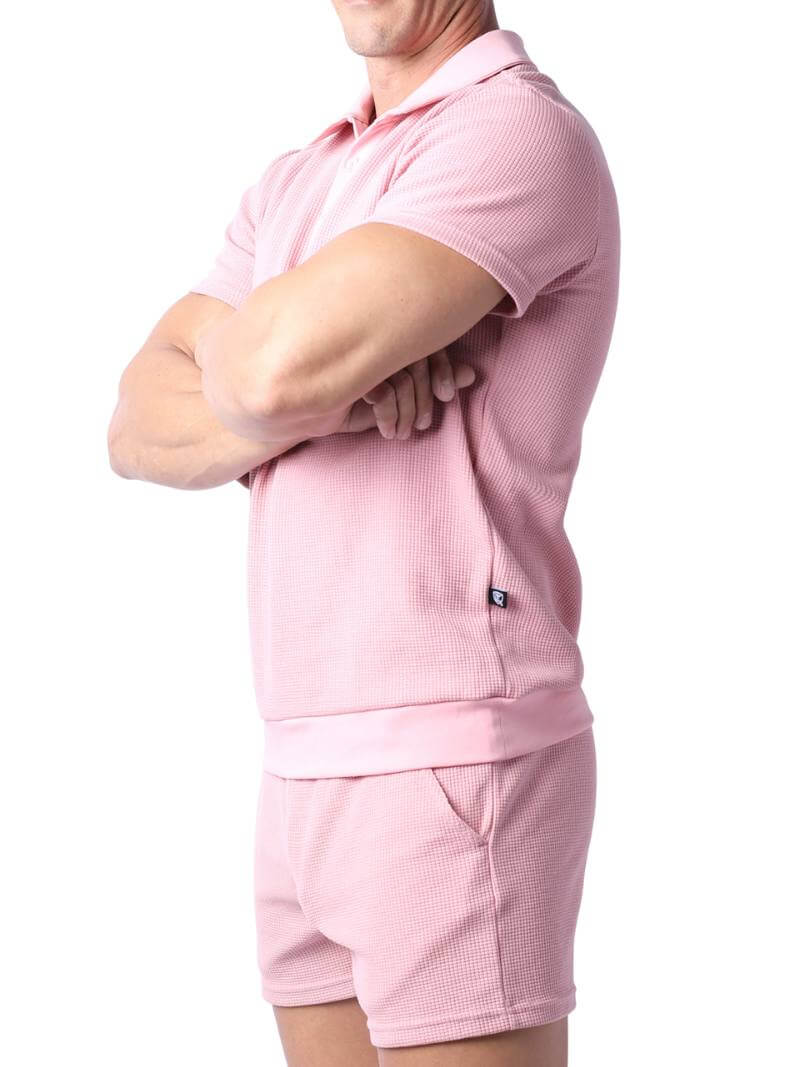 Close-up of a pink checkered garment with a focus on texture and pattern.