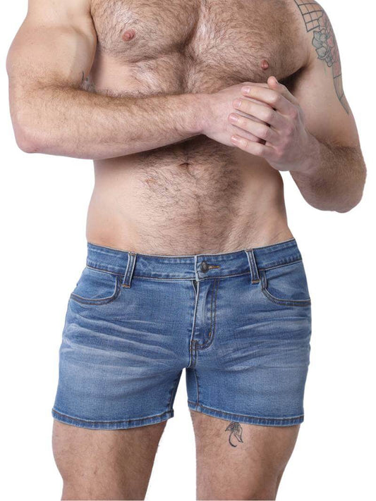 A pair of denim booty shorts with a low-rise waist and a 4-inch inseam, featuring a zipper fly, button fastening, belt loops, and four pockets. The shorts are blue with contrast stitching, and there is a leather branded patch on the back.