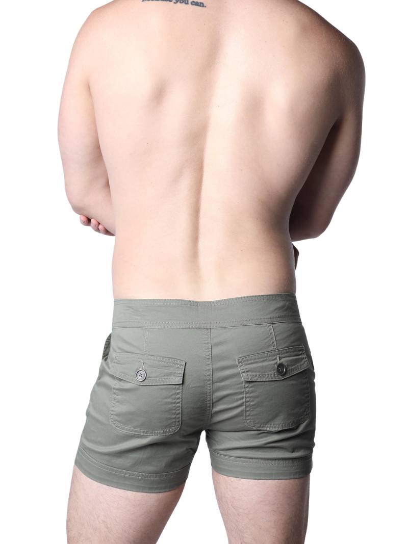 Man wearing beige shorts on a white background