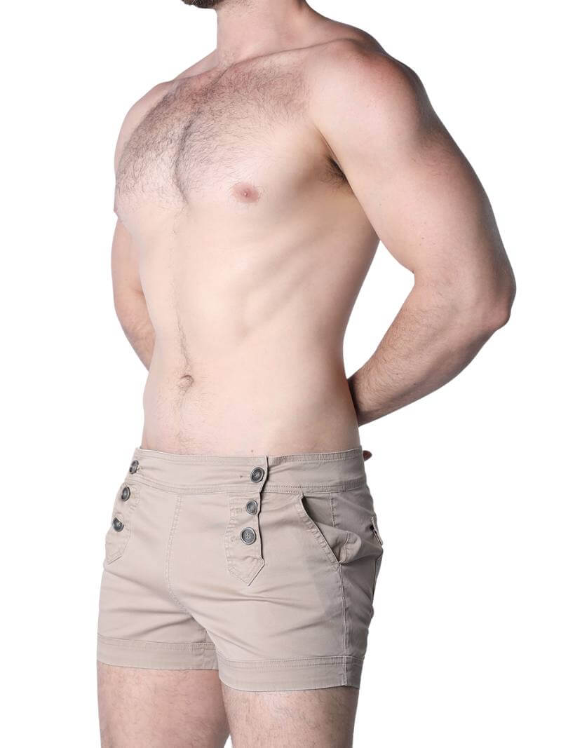 Man wearing beige shorts on a white background