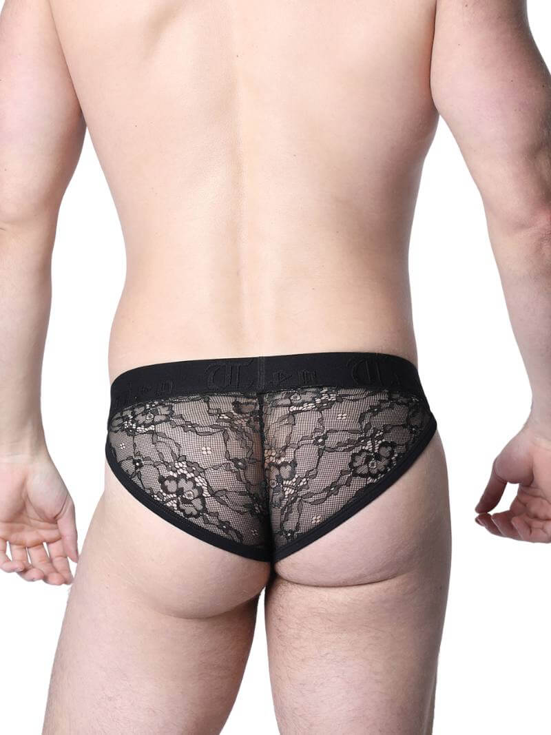Man wearing black lace underwear in an urban setting