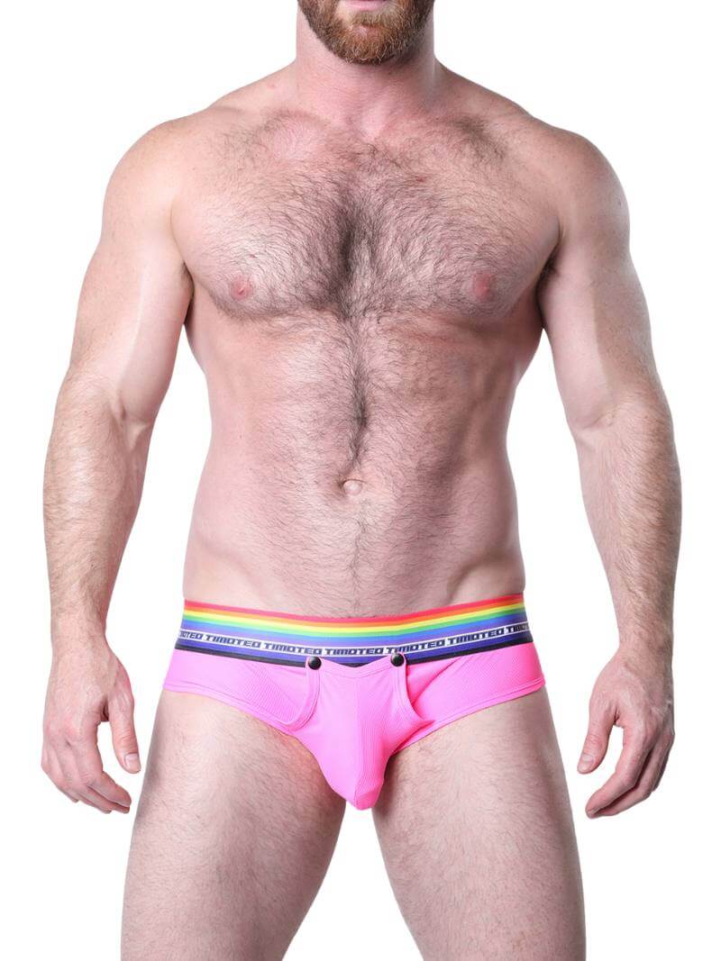 Man wearing blue underwear with a rainbow waistband on a white background
