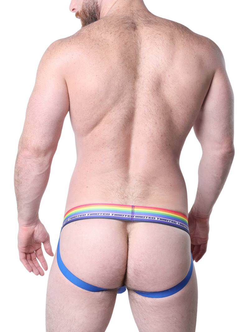 Man wearing blue underwear with a rainbow waistband on a white background