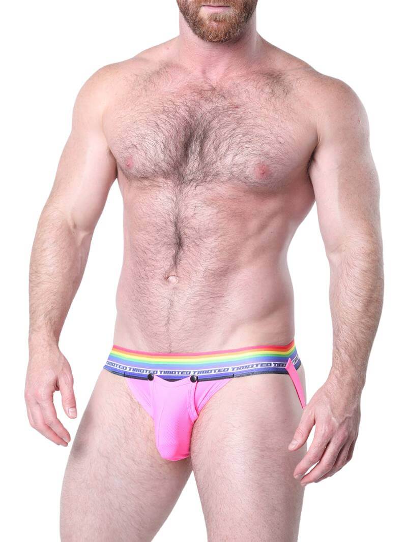 Man wearing pink underwear with a rainbow waistband on a white background