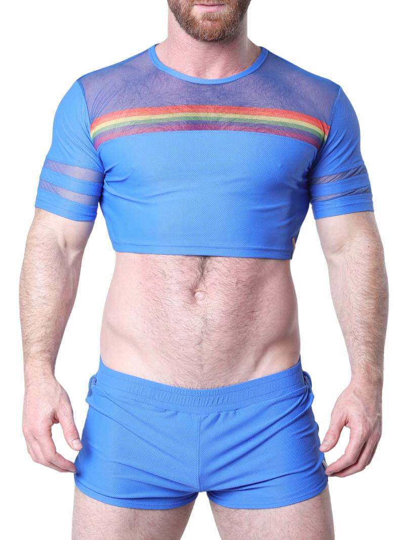 Man wearing a pink athletic outfit with rainbow stripes on a white background