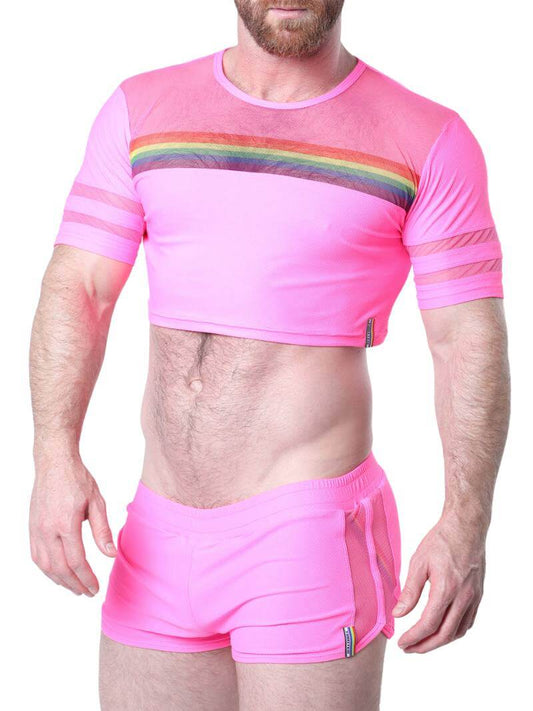 Man wearing a pink athletic outfit with rainbow stripes on a white background