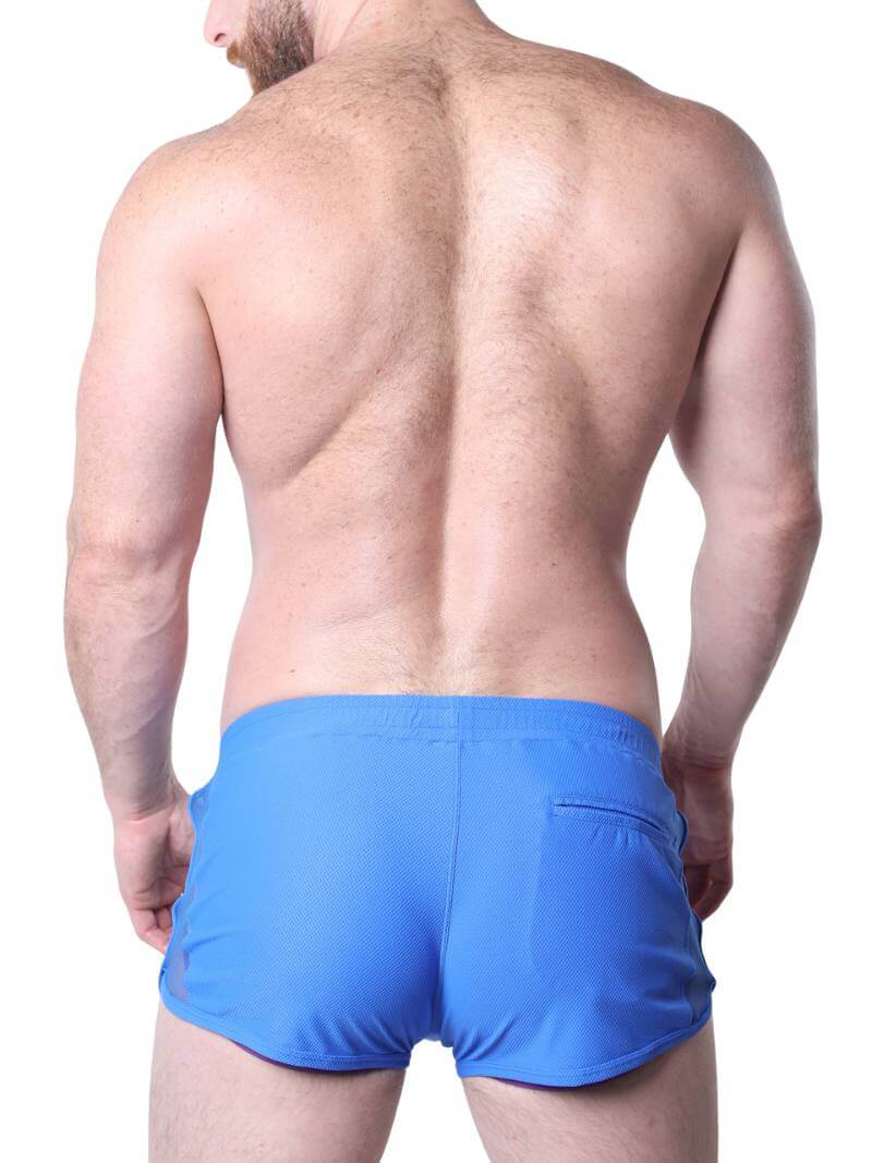 Man wearing blue underwear with mesh panels on a white background