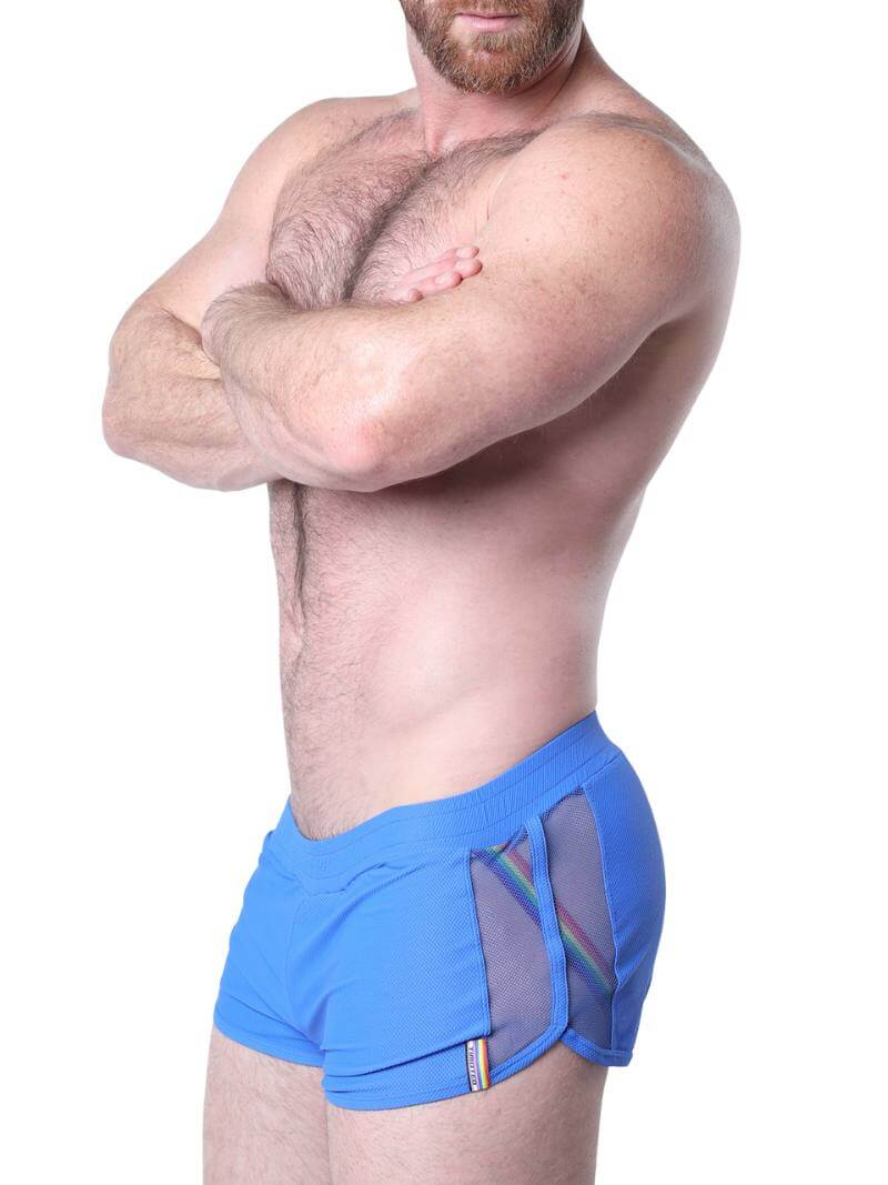 Man wearing blue underwear with mesh panels on a white background