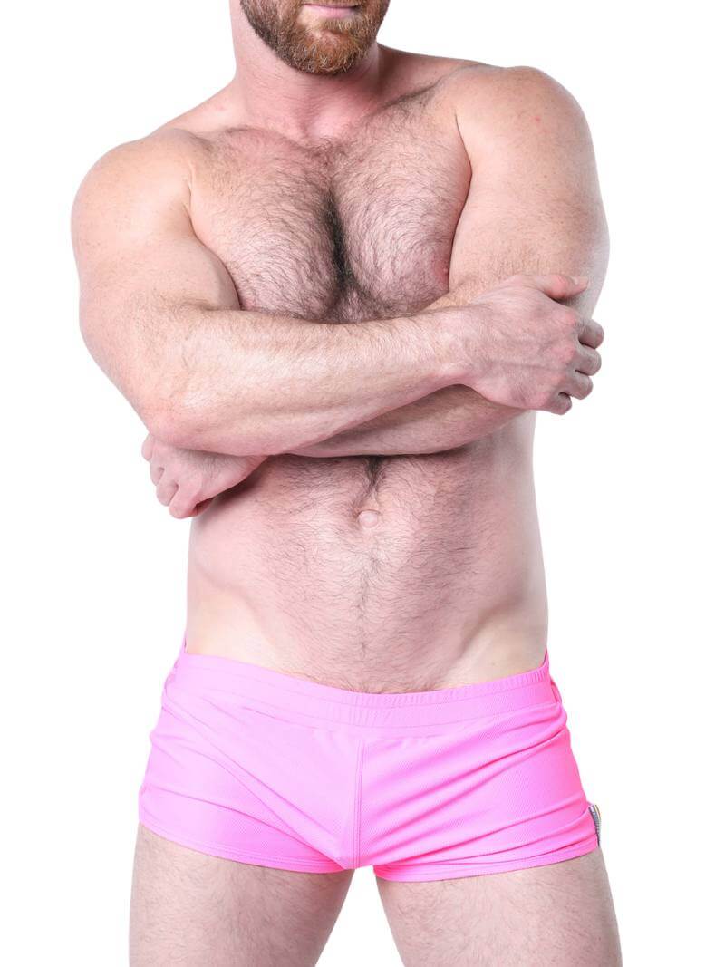 Man wearing blue underwear with mesh panels on a white background