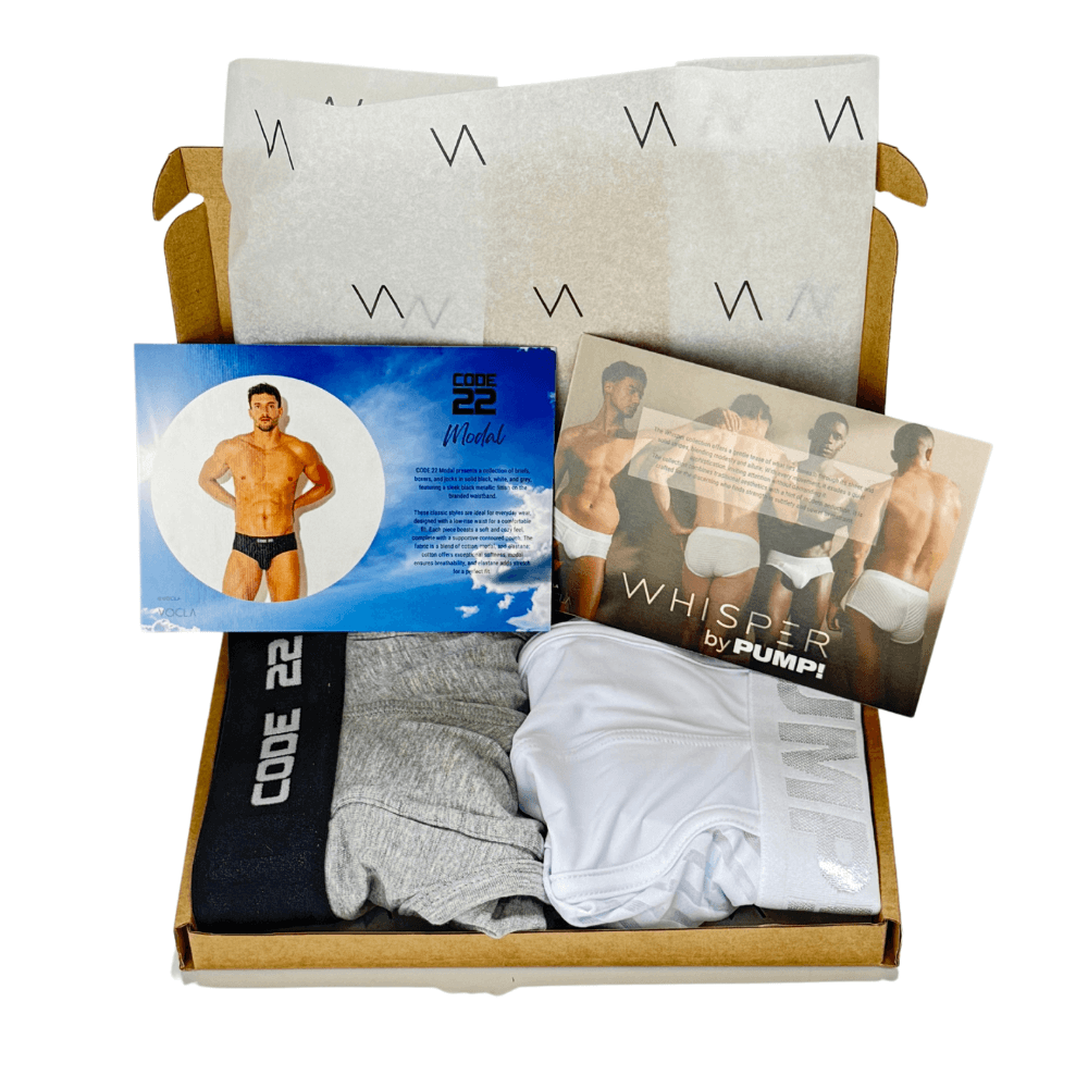 Box of men's underwear with packaging and brochures on a white background