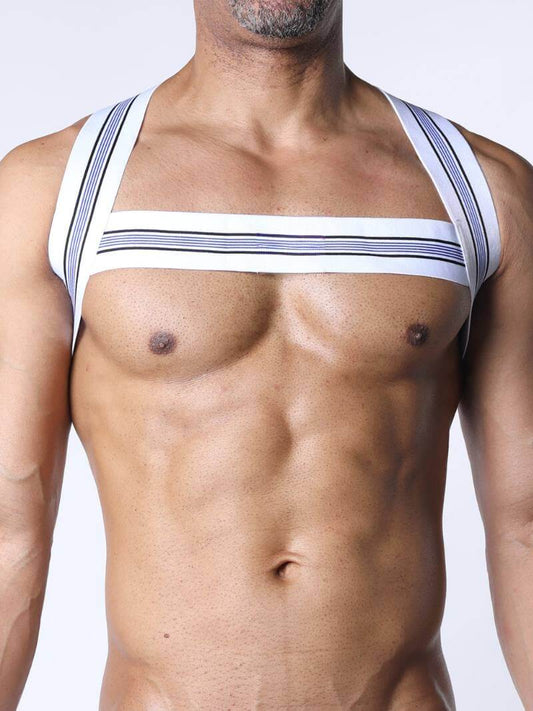 Man wearing a white harness with black stripes on a plain background