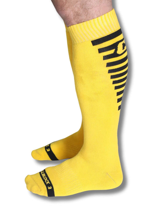 Yellow knee-high socks with black logo on a white background