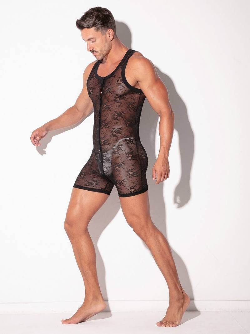 Man wearing a sheer black romper against a white background