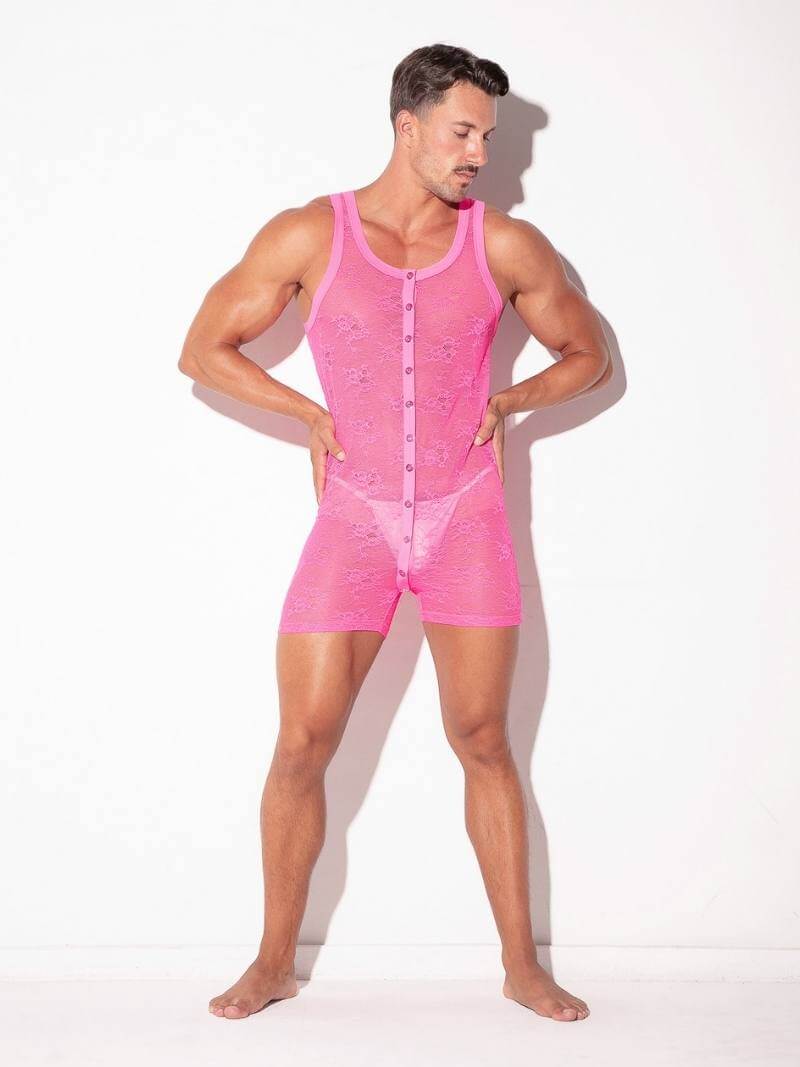 Man wearing a pink bodysuit against a white background