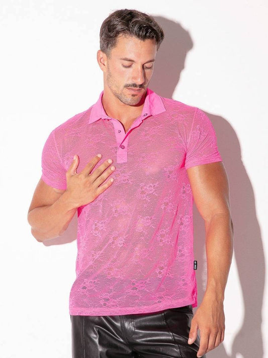 Man wearing a pink lace shirt against a white background