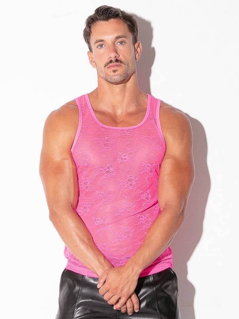 Man wearing a pink tank top against a white background