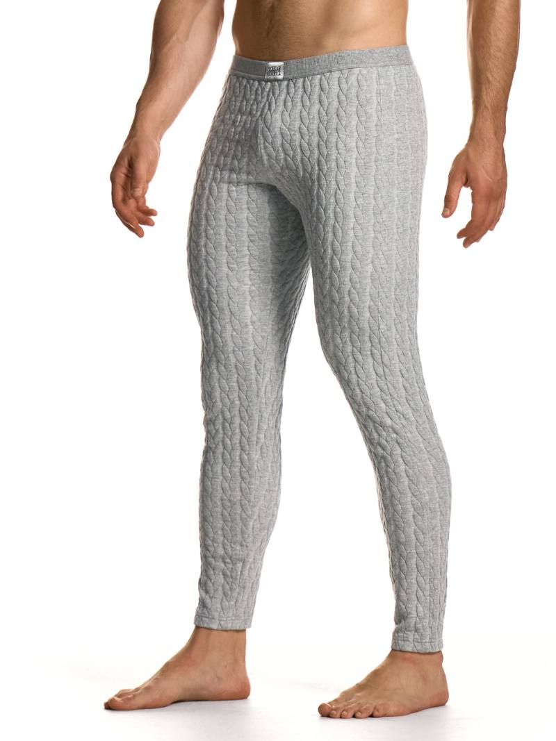 Person wearing gray textured pants on a white background