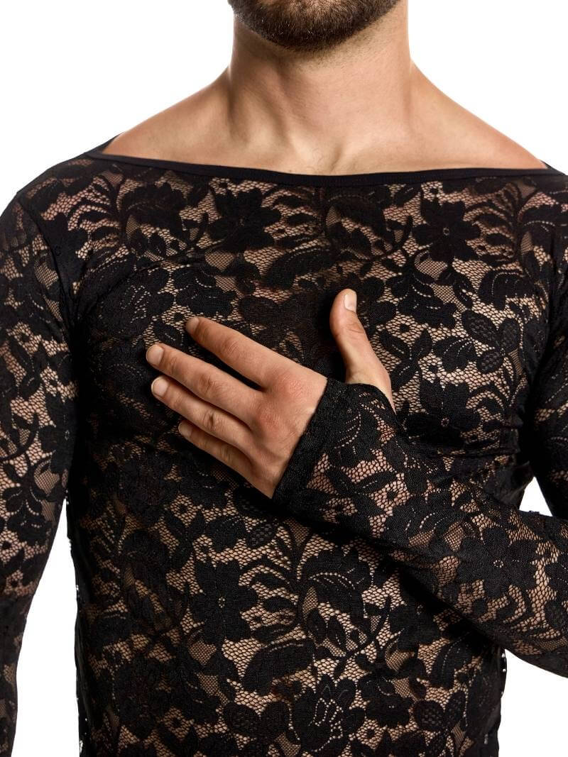 Person wearing a black lace top with long sleeves on a white background