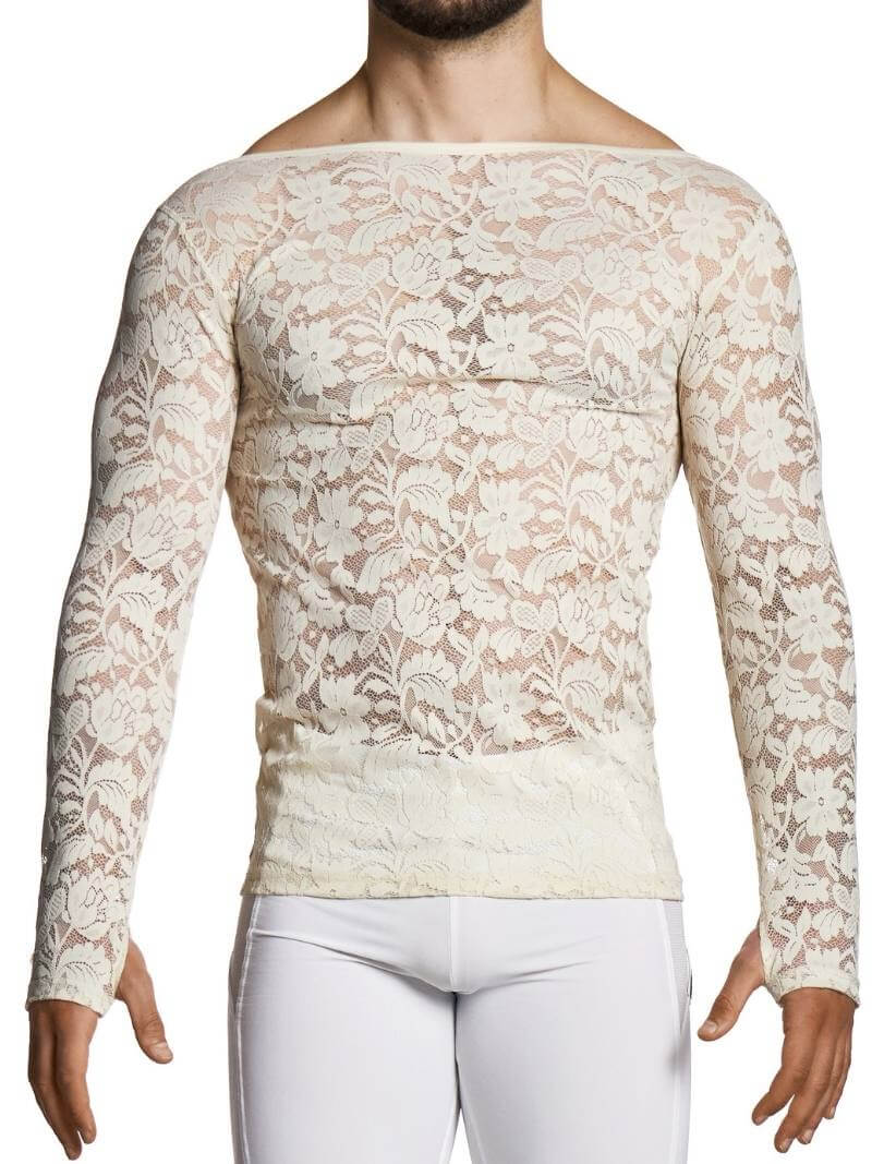 Man wearing a beige lace long-sleeve top and white pants on a white background