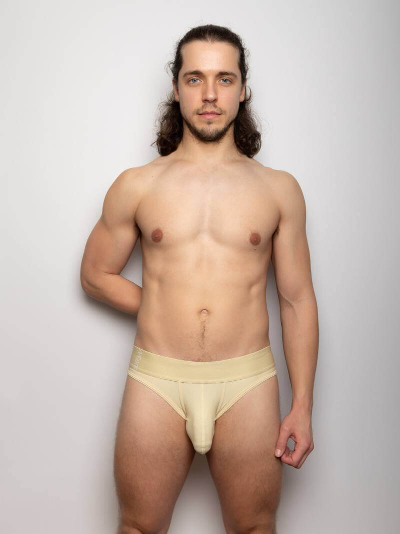 Men's SUKREW beige underwear set against a plain background