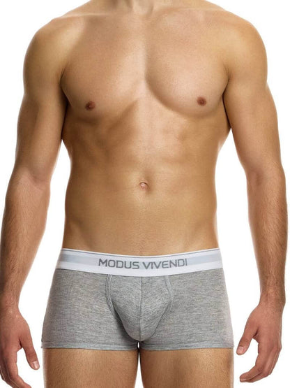 This image displays the MODUS VIVENDI Staple Boxer in a striking turquoise color, emphasizing its design features and fit. The boxer briefs are crafted from an eco-friendly cotton blend, including recycled yarns, supporting both sustainability and comfort.