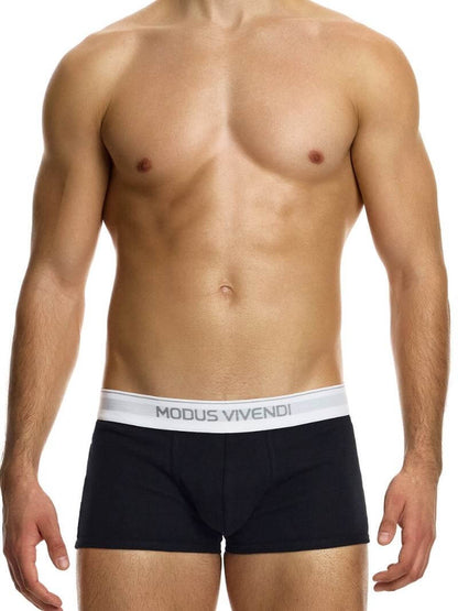 This image displays the MODUS VIVENDI Staple Boxer in a striking turquoise color, emphasizing its design features and fit. The boxer briefs are crafted from an eco-friendly cotton blend, including recycled yarns, supporting both sustainability and comfort.