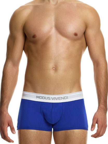 This image displays the MODUS VIVENDI Staple Boxer in a striking turquoise color, emphasizing its design features and fit. The boxer briefs are crafted from an eco-friendly cotton blend, including recycled yarns, supporting both sustainability and comfort.