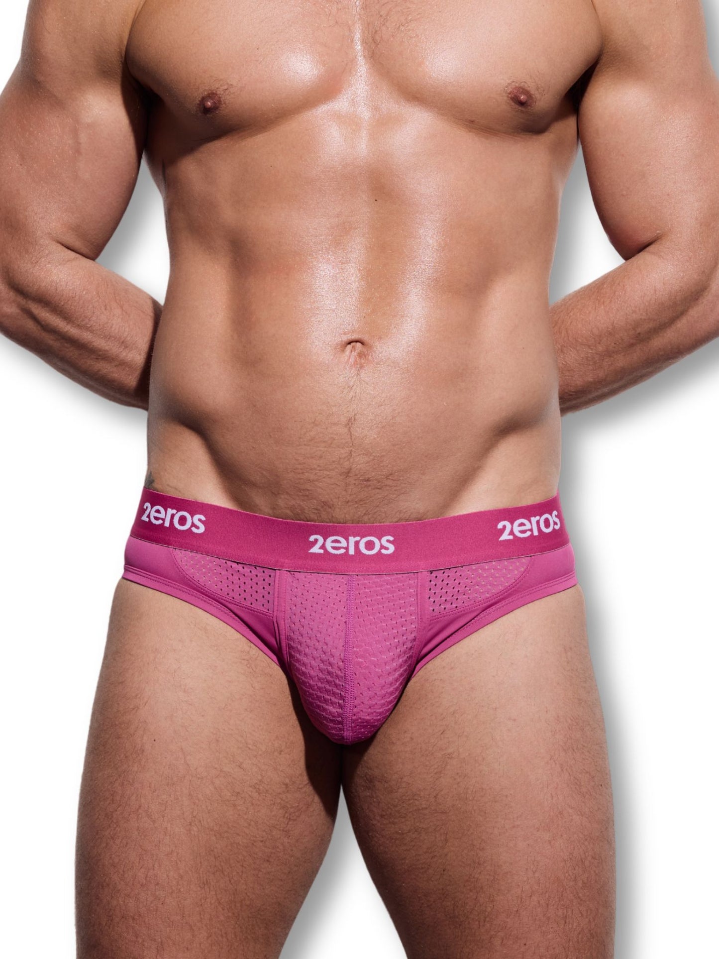 Man wearing pink underwear with '2eros' branding on a white background