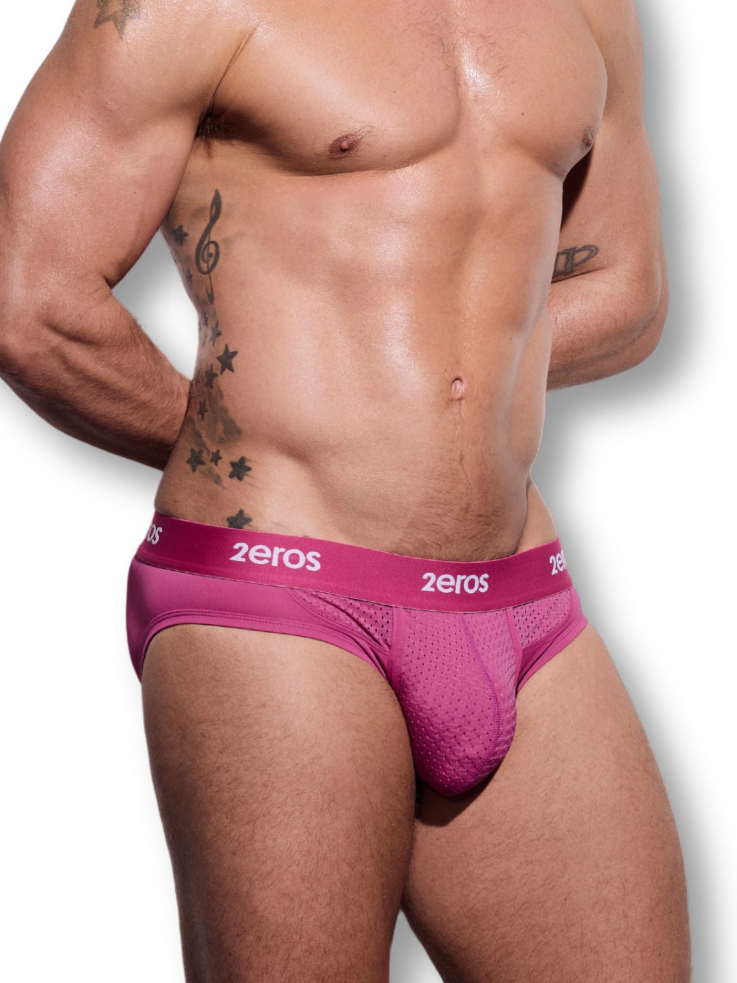 Man wearing pink '2eros' underwear on a white background