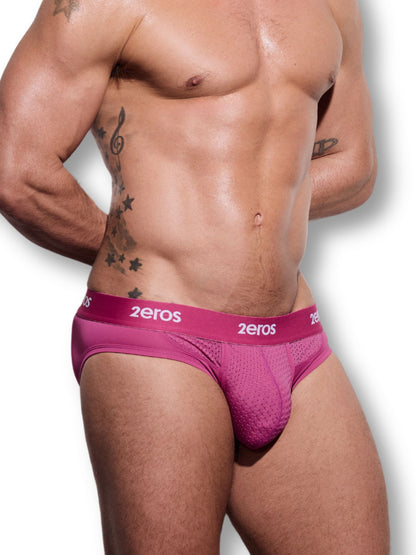 Man wearing pink '2eros' underwear on a white background