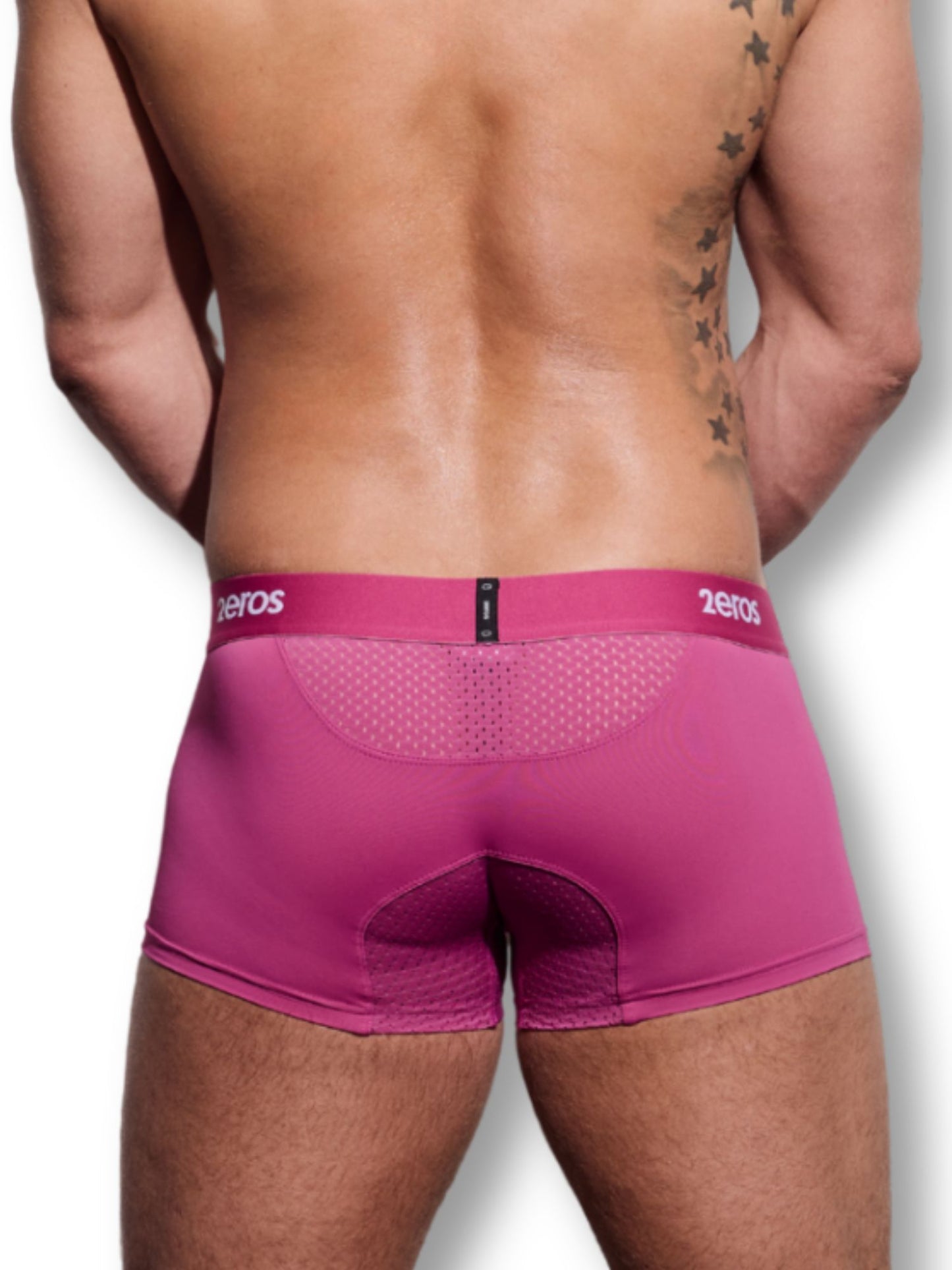 Person wearing pink underwear with '2eros' branding on a white background
