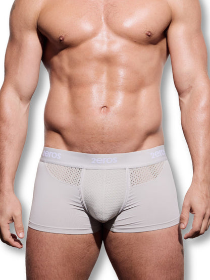 Man wearing light gray boxer briefs on a white background