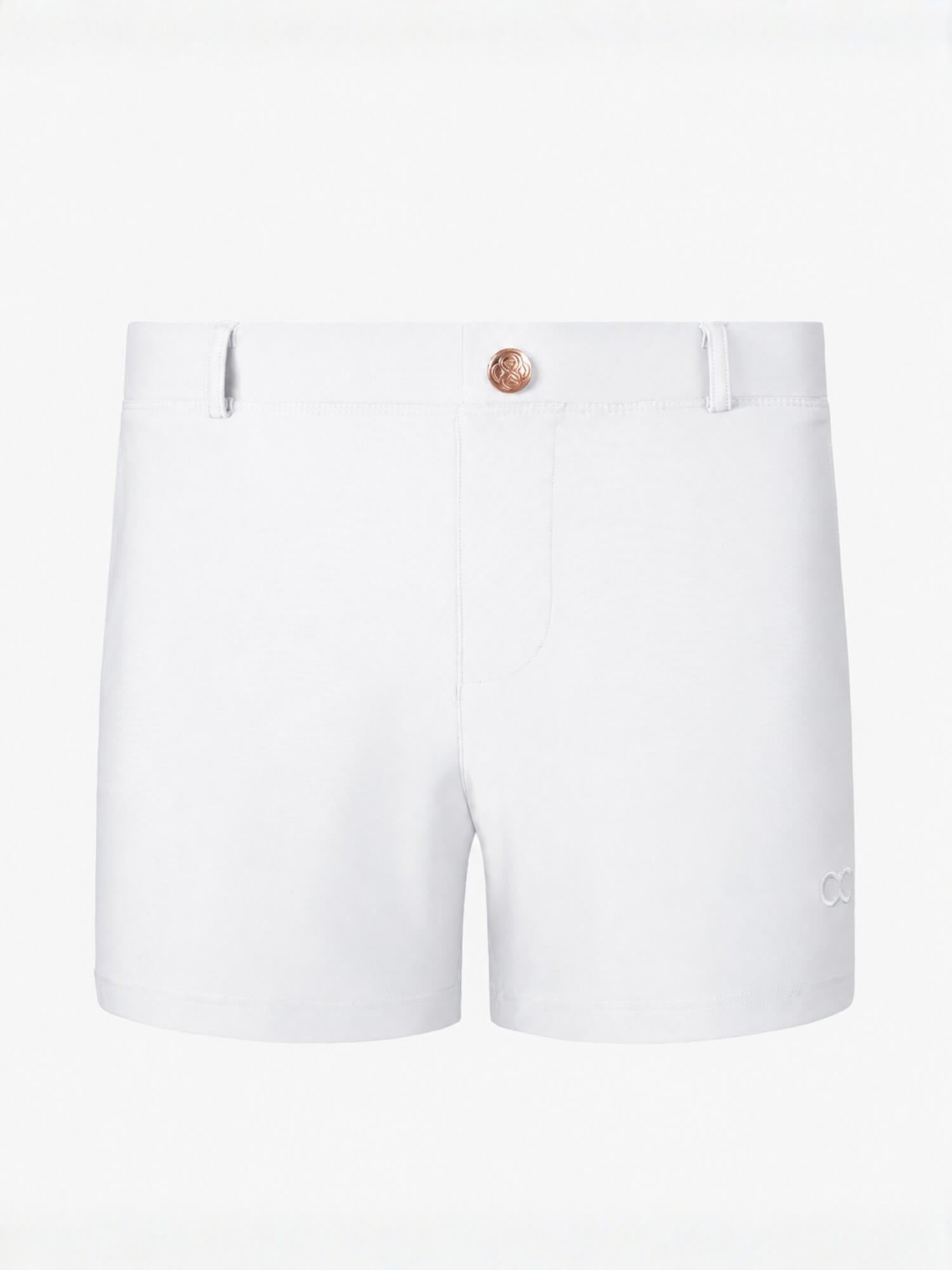 White women's shorts with a single rose gold button closure, belt loops, and a small embroidered logo on the lower left leg, shown against a plain white background.