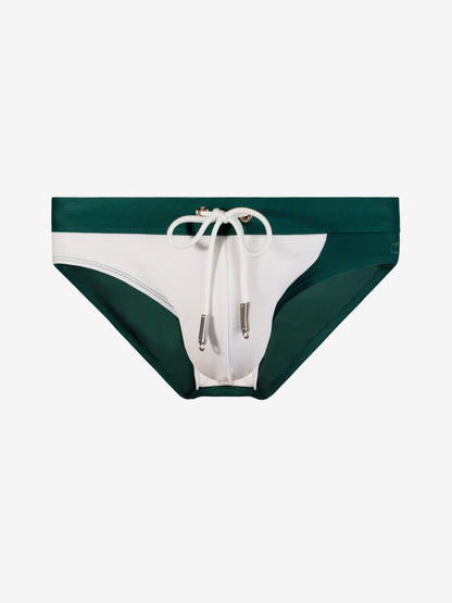 Colorblock bikini bottoms in dark green and white with a white drawstring waistband, shown flat on a light gray background.