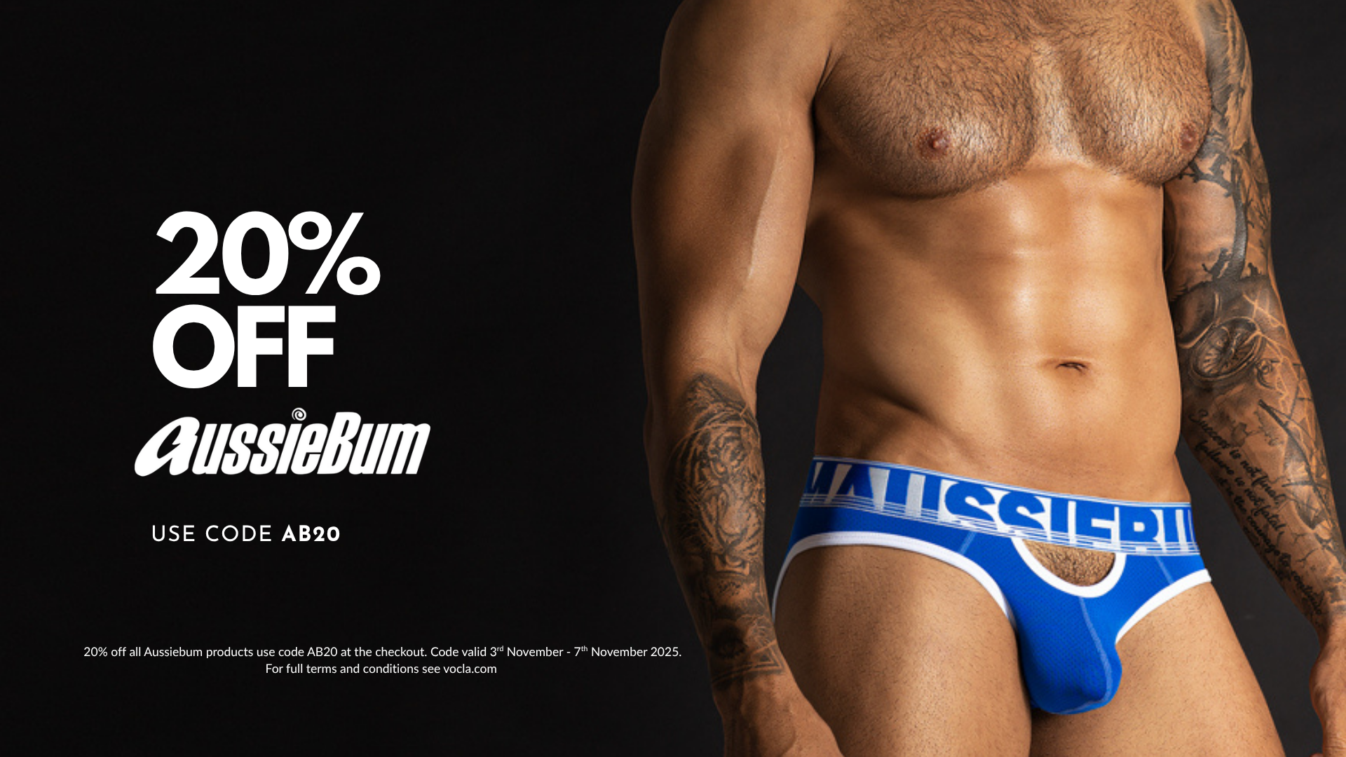 Man wearing blue AussieBum underwear with promotional text on a black background