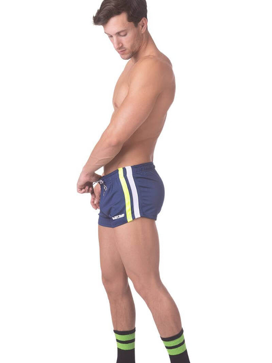 A model wearing royal blue short-legged shorts with sporty side stripes and a drawstring waist.