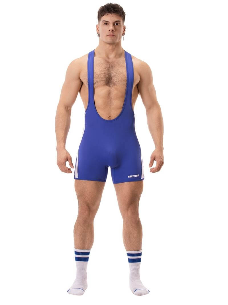 A man wearing a red Barcode Berlin backless singlet with white stripes and a low-cut neck.