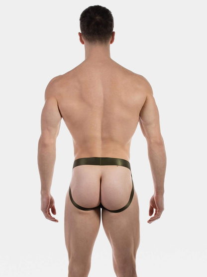 man wearing olive green men's jockstrap with shimmer waistband and leg straps on a plain white background