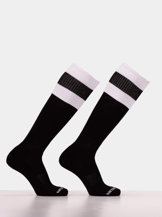 A pair of black knee-high athletic socks with two white horizontal stripes near the ribbed cuffs, displayed on invisible forms against a light gray background.