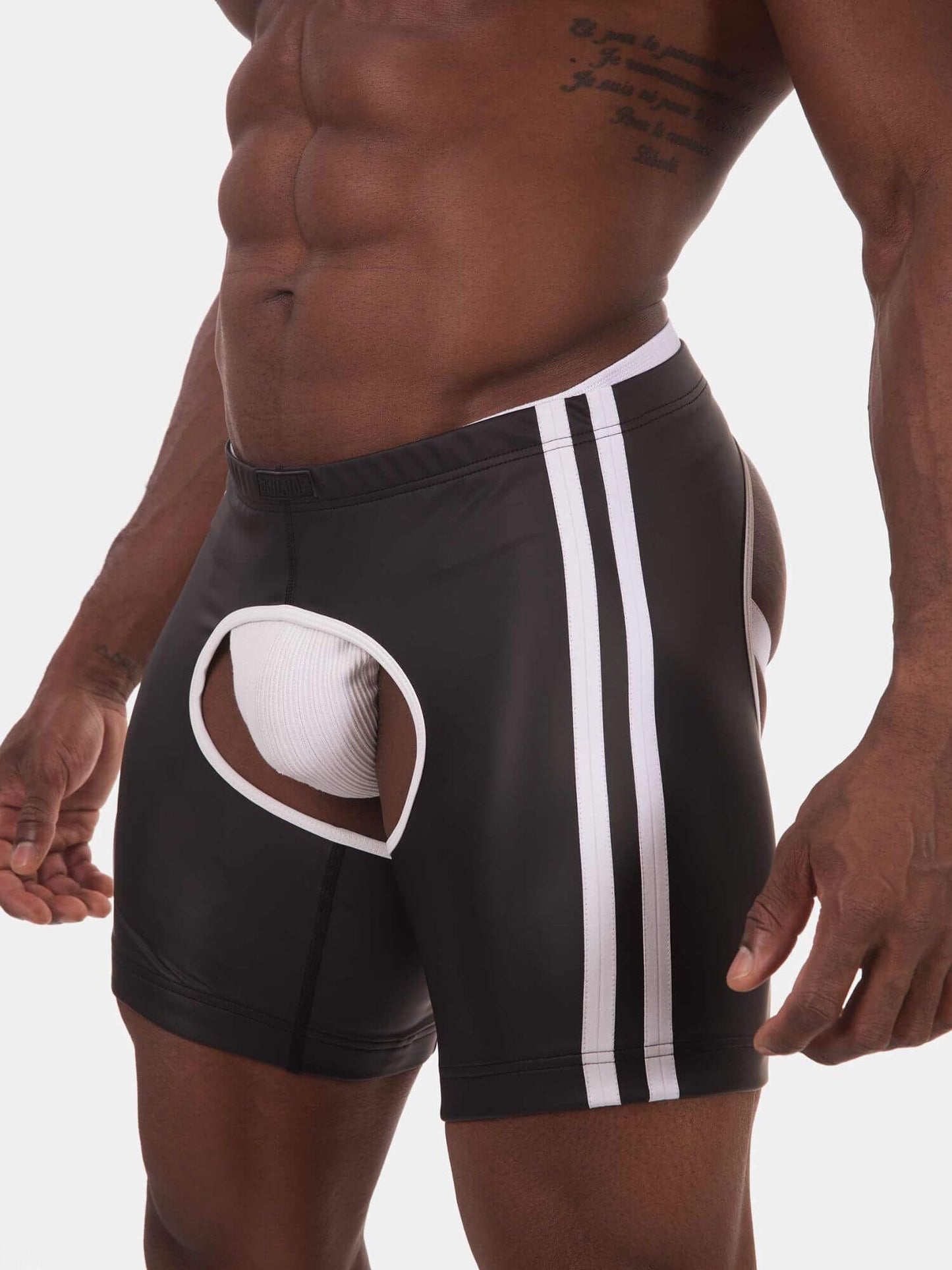Black athletic briefs with white side stripes and a white inner pouch, shown on a male model against a light gray background.