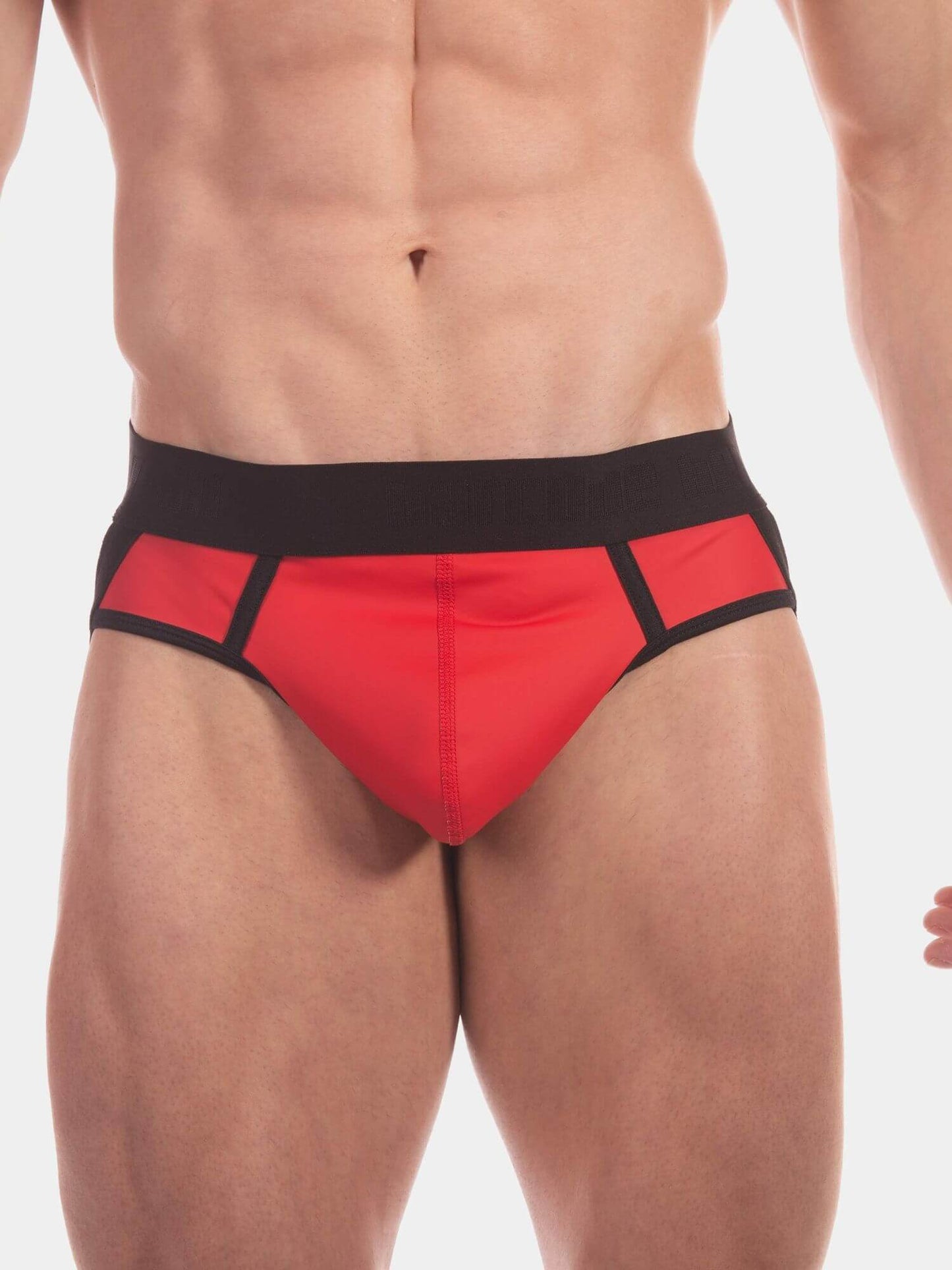 Red and black men's jocks worn by a male model, shown from the waist down against a plain white background.