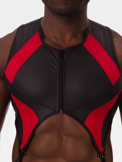 A close-up of a man wearing a black and red athletic tank top with a front zipper and cutout details.