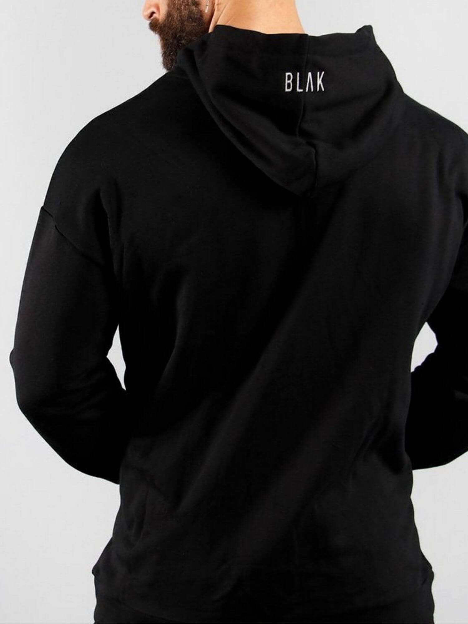 Black hoodie with 'BLAK' branding on the back against a gray background