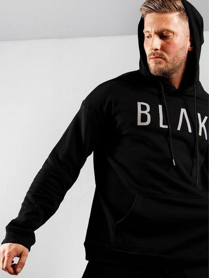 Man wearing a black hoodie with 'BLAK' logo on a white background
