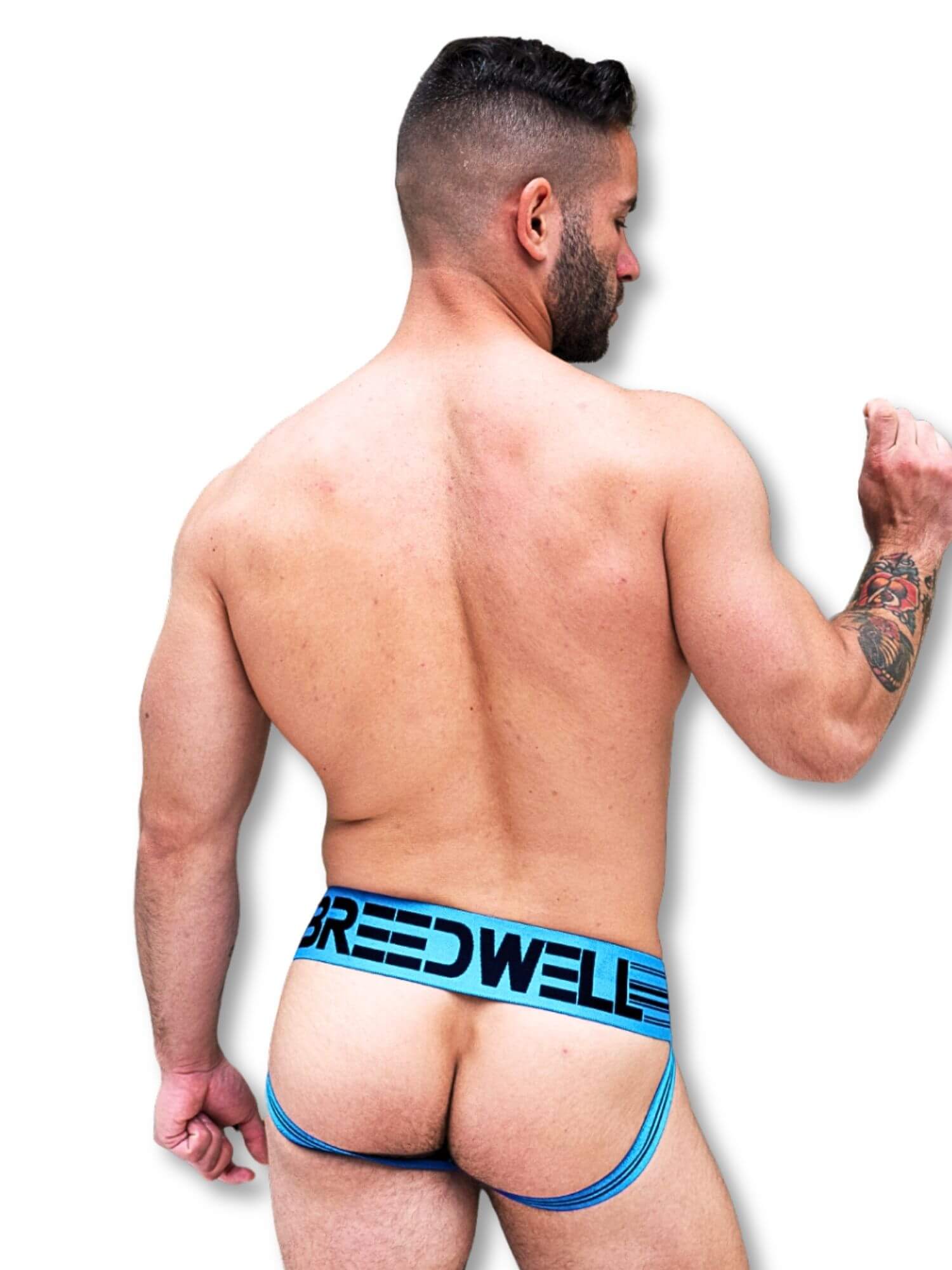 Man wearing blue underwear with 'Breedwell' branding on a white background