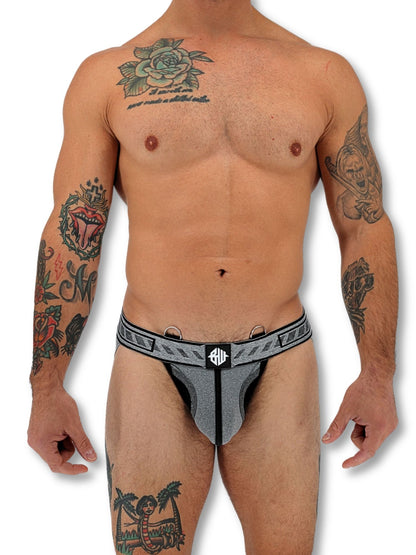 Man wearing a gray men's underwear with a brand logo on a white background