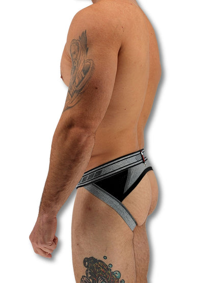 Man wearing black and gray underwear on a white background