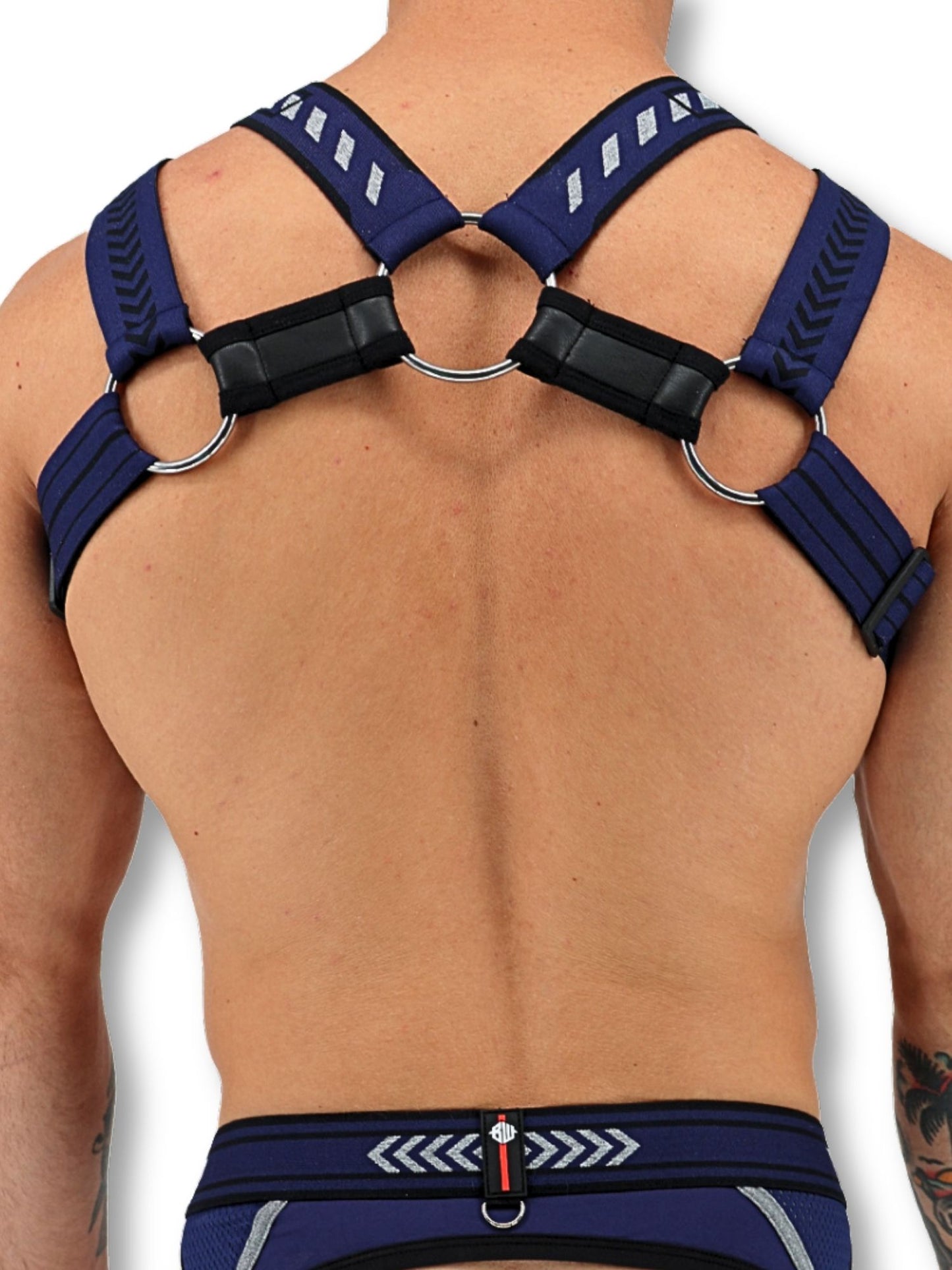 Blue harness worn by a person on a white background