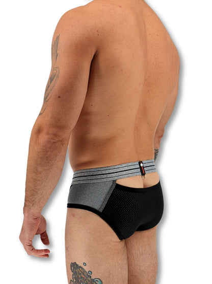 Man wearing black and gray underwear on a white background